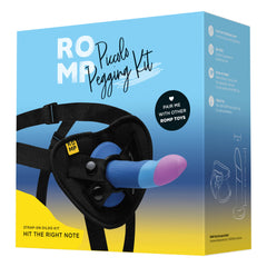 ROMP Piccolo Pegging Kit box showing strap-on harness and tri-color silicone dildo