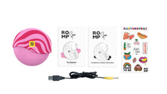 ROMP Spin unboxed with USB charging cable, instruction booklet, and sticker sheet