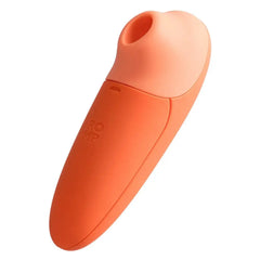 ROMP Switch X coral silicone clitoral stimulator side view highlighting two-tone ergonomic body