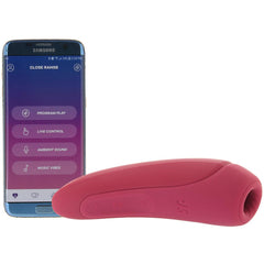 Rose red Satisfyer Curvy 1+ beside a phone displaying app controls: Program Play, Live Control, Music Vibes