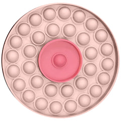 Round pink silicone pop-it with raised centre bubble, shown unpackaged from above
