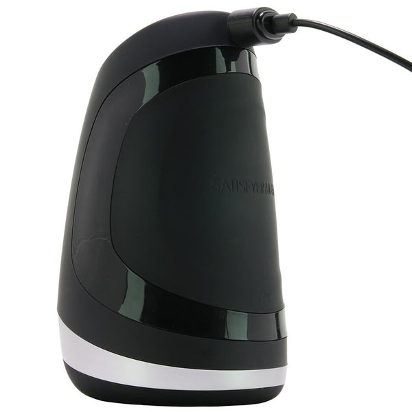 Satisfyer Men Heat Vibration masturbator shown upright connected to magnetic USB charging cable