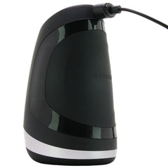Satisfyer Men Heat Vibration masturbator shown upright connected to magnetic USB charging cable