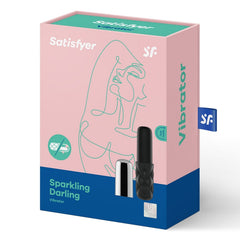 Satisfyer Sparkling Darling vibrator shown beside its pink and teal retail gift box packaging
