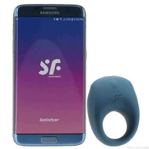 Satisfyer Strong One blue silicone ring beside a Samsung phone showing the SF Connect app