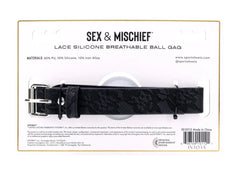 Sex & Mischief ball gag shown in retail packaging displaying lace strap and product label details