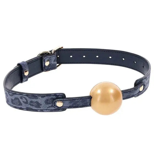 Sex & Mischief Cougar Ball Gag with navy leopard-print strap and gold-tone ball, front view