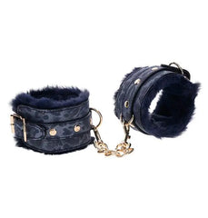 Sex & Mischief Cougar Fur Handcuffs in navy blue with gold chain and buckle hardware