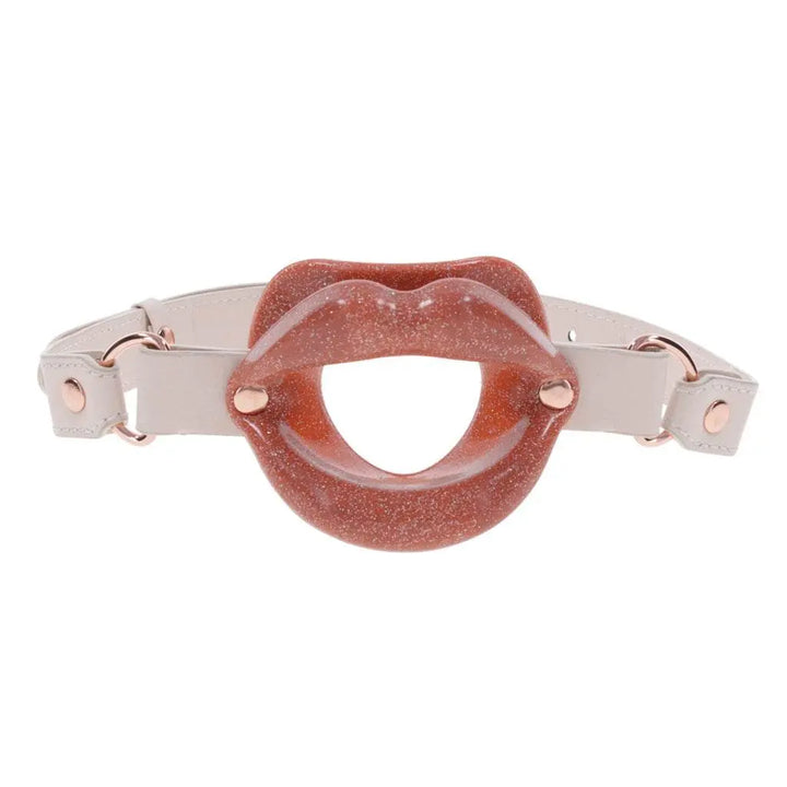 Sex & Mischief Silicone Lips gag in glittery rose with cream faux-leather strap, front view