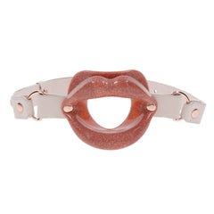 Sex & Mischief Silicone Lips gag in glittery rose with cream faux-leather strap, front view