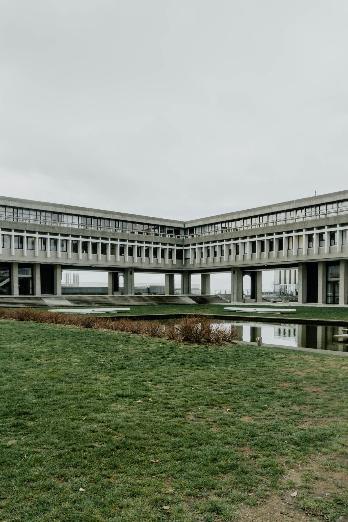 Pond beside the concrete architecture of Simon Fraser University in Burnaby
