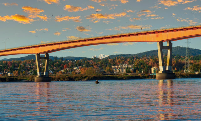 A bridge over the Fraser River at sunset in the Lower Mainland, BC