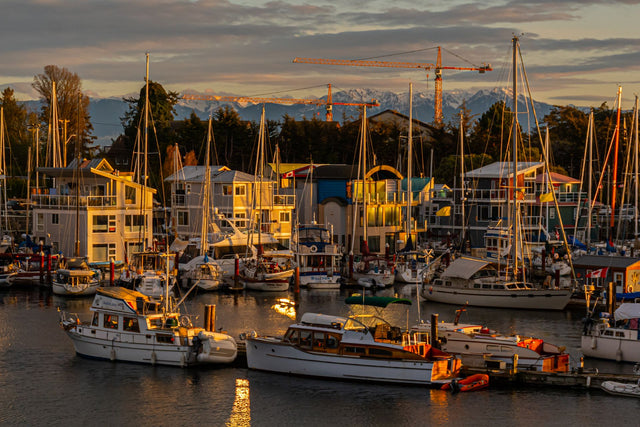 Boats moored at a marina in Esquimalt, BC, at sunset