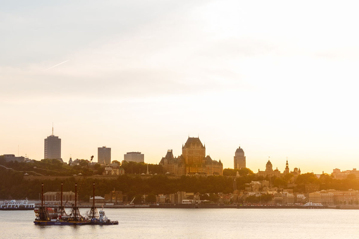 Quebec City skyline at sunset with the Château Frontenac and the St. Lawrence River