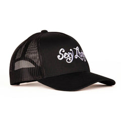 Sexy Living black cap angled left, structured front panel with raised white embroidery detail visible