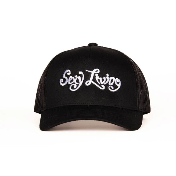 Sexy Living black trucker cap, front view showing white embroidered script logo on structured panel