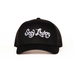 Sexy Living black trucker cap, front view showing white embroidered script logo on structured panel