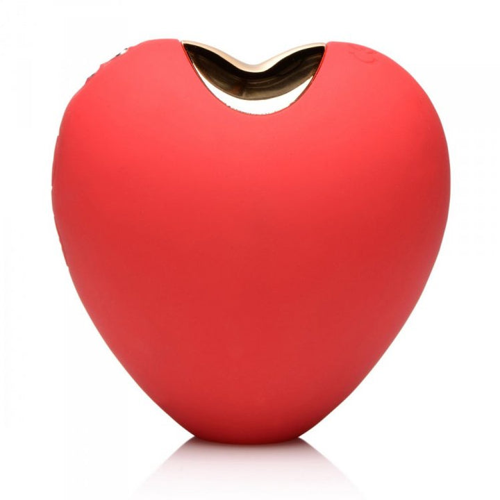 Shegasm 10X Heart's Desire red silicone clitoral stimulator, heart-shaped front view with gold-trim opening