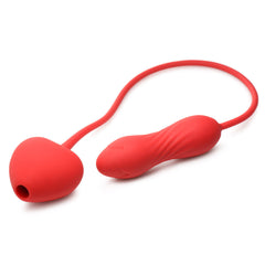 Shegasm 10X Love On Me red silicone dual-device set connected by flexible cord, side view