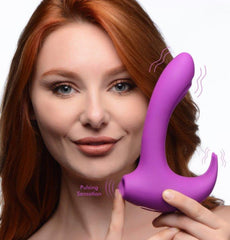 Shegasm 12X Lux Rocker purple silicone rabbit vibrator held beside model's face, pulsing sensation labeled