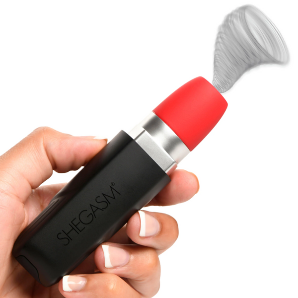 Shegasm Pocket Pucker lipstick clit stimulator held in hand, red silicone tip vibrating