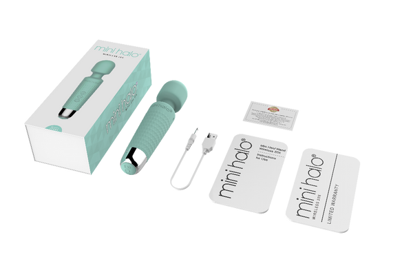 Shibari Mini Halo unboxed showing device, USB charging cable, and warranty cards
