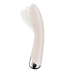 Side angle of beige Spinning Vibe 1 silicone shaft illustrating the rotating tip movement