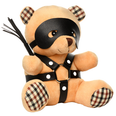 Side angle of Bondage Bear plush showing plaid fabric ears, paws, and black vegan leather eye mask