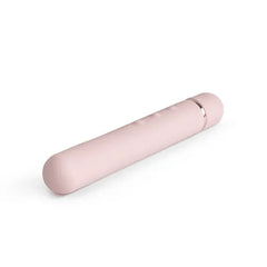 Side angle of Le Wand Baton pink silicone slim vibrator with flexible rounded tip