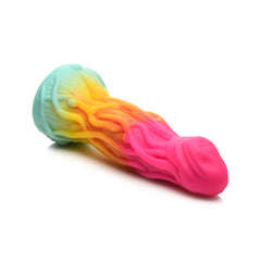 Side-angle view of Shape Shifter alien dildo laying flat, showing suction cup base and gradient silicone