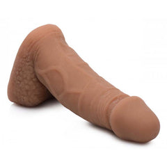 Side angle of Strap U Large Bulge Packer Dildo displaying realistic veining and pliable medium-tone material