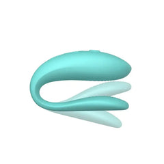 Side view of aqua We-Vibe Sync Lite showing flexible dual-arm design and slim profile