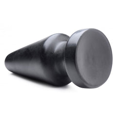 Side view of black Ass Max Plug lying flat, highlighting flat circular base and smooth finish