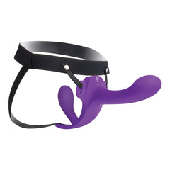 Side view of black elastic harness with silver O-ring holding purple silicone dual-ended dildo in place