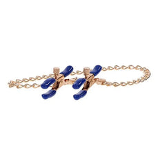 Close side view of both adjustable clamps together, showing blue-tipped jaws and rose-gold hardware