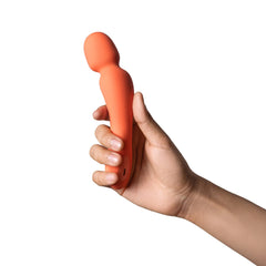 Side view of Dame Min Mini Wand held in one hand, demonstrating slim ergonomic handle length