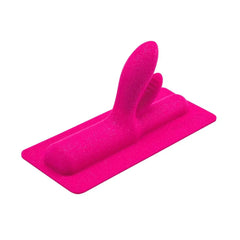 Side-elevated angle of Jackalope pink silicone attachment highlighting dual-arm shape and base
