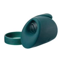 Side view of Gush with detached silicone cock ring beside the main massager body