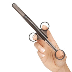 Side view of hand gripping black applicator with finger rings and barrel mechanism