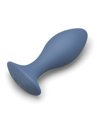 Side-laying view of the rechargeable anal plug revealing the flat base with charging port