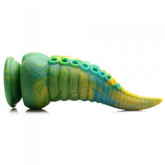 Side view of Monstropus tentacled dildo lying flat, showing curved profile and suction cup base