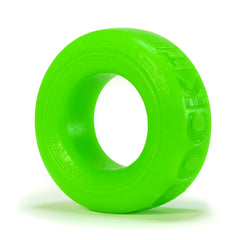 Close-up side view of Oxballs COCK-T slime green silicone cock ring showing embossed lettering