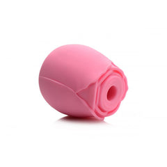 Side view of pink silicone rose-shaped clitoral suction stimulator showing suction opening
