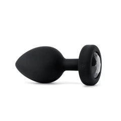 Side profile of b-Vibe Jewel Plug XXL showing smooth black silicone and jewel base