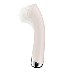 Side profile close-up of beige silicone curved G-spot vibrator head with spinning tip detail
