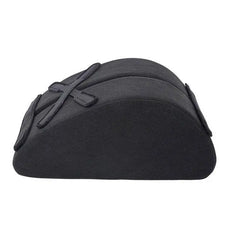 Side profile of black half-moon foam positioning wedge with adjustable mounting straps
