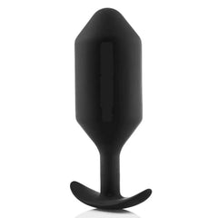 Side profile of black silicone plug highlighting smooth surface and slim neck
