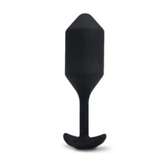 Close-up side profile of black silicone snug plug showing smooth matte finish and slim neck