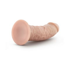 Side profile of Dr. Skin Glide dildo lying flat, showing suction cup base and texture
