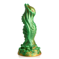 Side profile of green and gold alien silicone dildo with raised texture and tentacle base